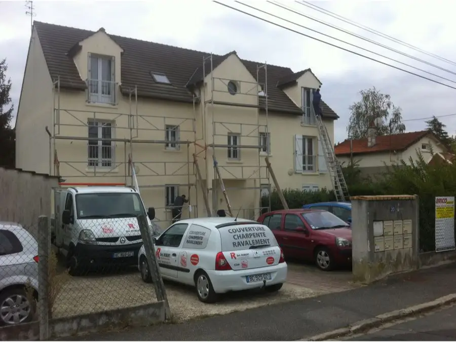 Pose d'isolant entre chevrons dans des combles aménagés dans l'Essonne